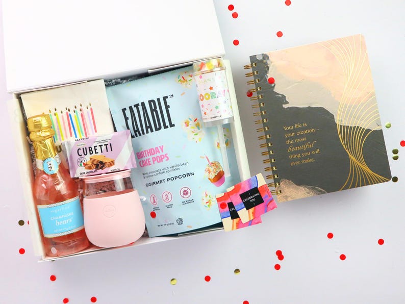Birthday gift box with journal, birthday cake popcorn, gummies, champagne bears, candle tumbler, and party decor confetti
