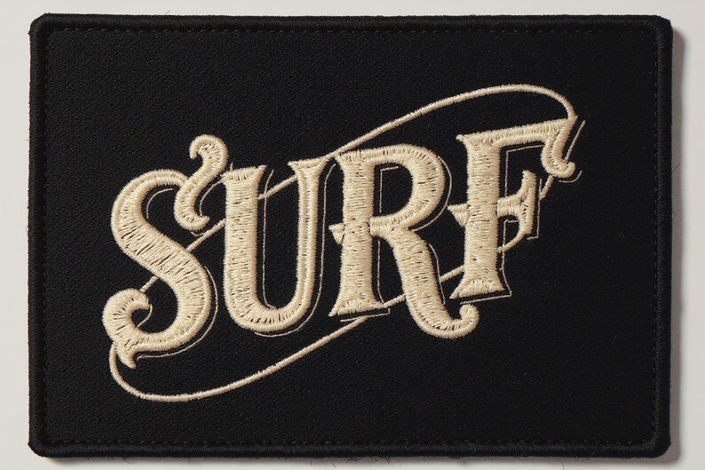 Surf Embroidered Patch Print framed in a beach-style living room setting