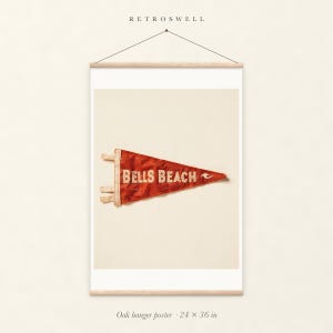 Bells Beach Surf Pennant oak hanger poster, 24 by 36 inches, with natural wood rails and a hanging cord.