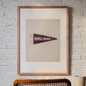 Myrtle Beach print in a Red Oak frame with a white mat, hanging above the desk in a home office.