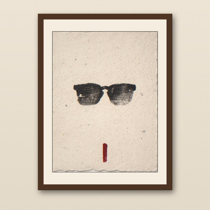 Sumi-e Wayfarer Sunglasses with Red Accent Print - walnut framed art print with cream mat on plaster wall