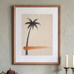 Palm Tree Ink Style print in a Red Oak frame with a white mat, hanging above the sideboard in a dining room.