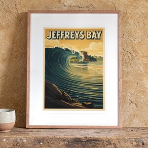 Jeffreys Bay Surf Travel Poster print in a Red Oak frame with a white mat, leaning on the bench against the wall in a boho living room.