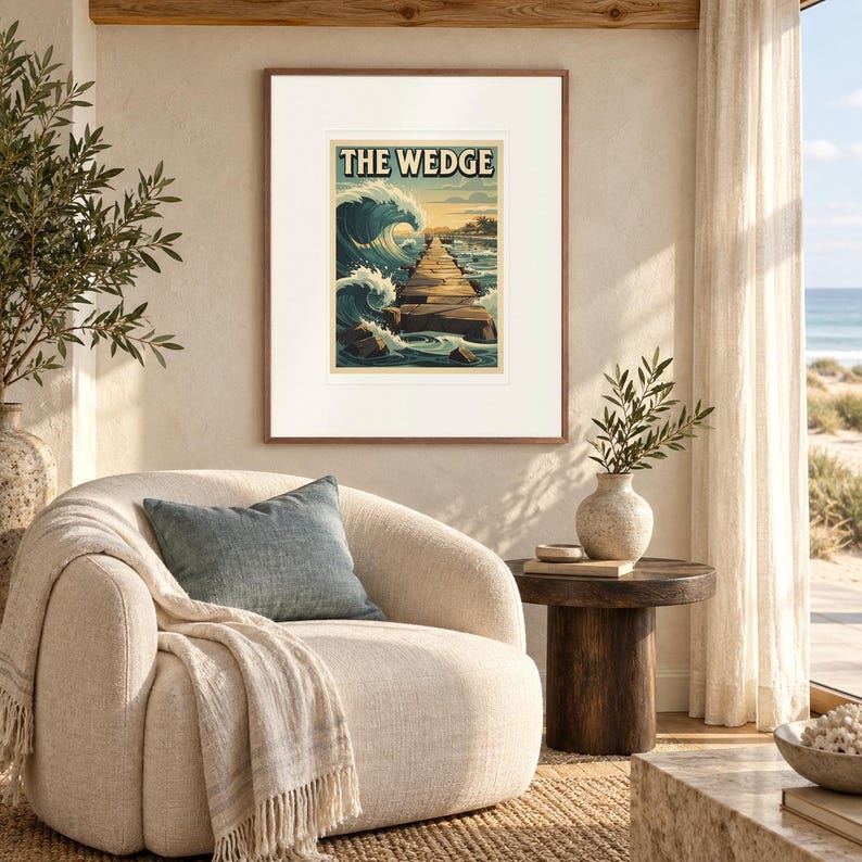 The Wedge Surf print in a Red Oak frame with a white mat in a light-filled coastal sitting room.