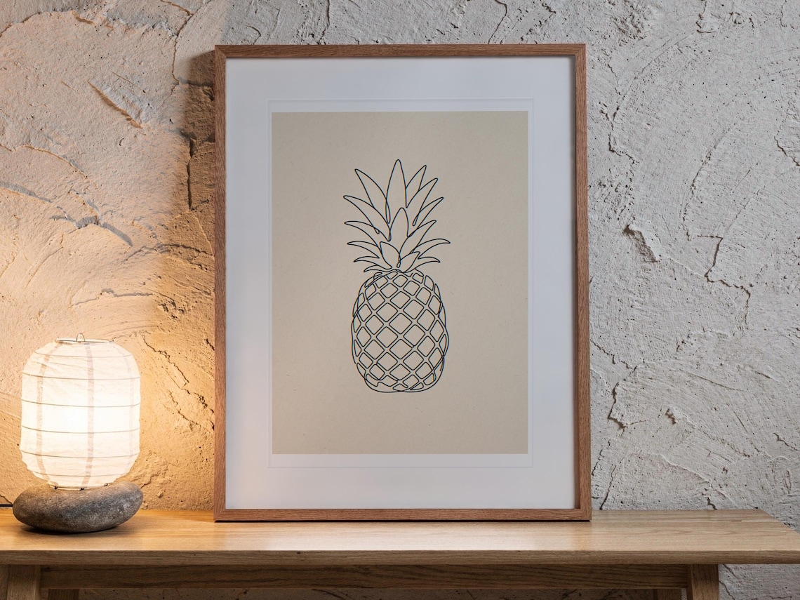 Pineapple Line print in a Red Oak frame with a white mat, leaning on the bench against the wall in a japandi living room.