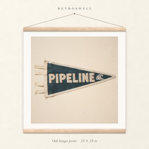 Pipeline Surf Pennant oak hanger poster, 18 by 18 inches, with natural wood rails and a hanging cord.