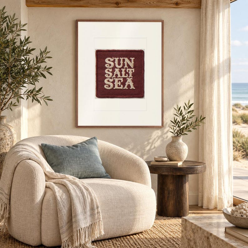 Sun Salt Sea Patch print in a Red Oak frame with a white mat in a light-filled coastal sitting room.