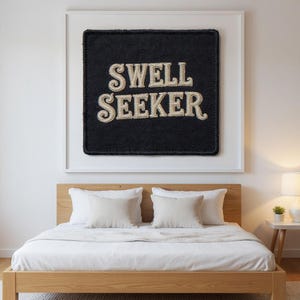 Swell Seeker Embroidered Patch Print framed in a modern bedroom setting