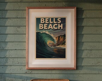 May include: A framed poster featuring a large, curling ocean wave in shades of deep blue and teal, with tall, rugged cliffs in the background. The text "BELLS BEACH" is printed in bold, light-coloured letters at the top of the artwork.