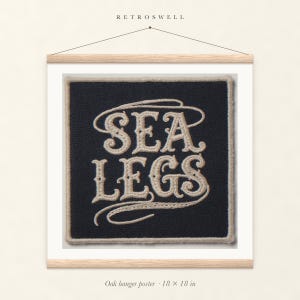 Sea Legs Patch oak hanger poster, 18 by 18 inches, with natural wood rails and a hanging cord.