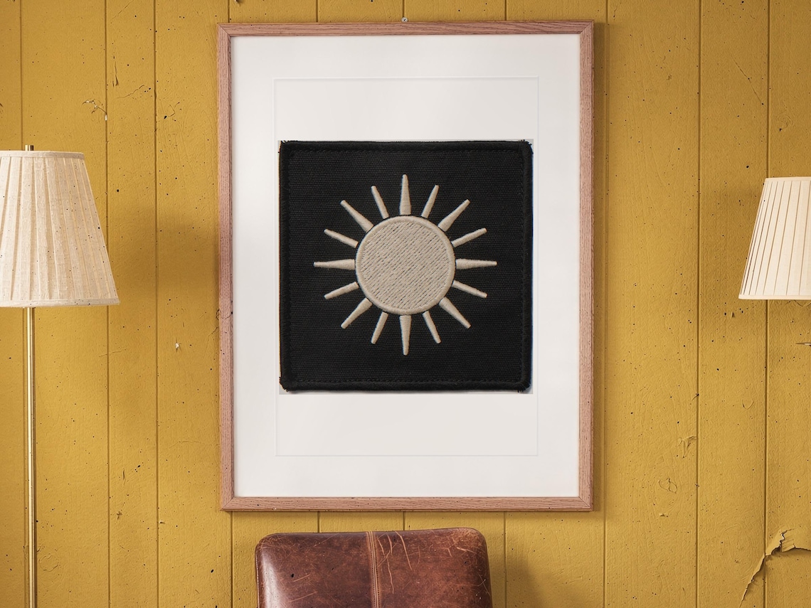 Sun Patch print in a Red Oak frame with a white mat, hanging on the paneling in a 1960s den.
