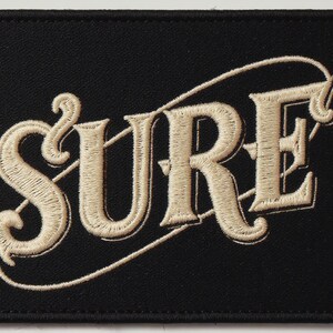 Surf Embroidered Patch Print framed in a home office setting