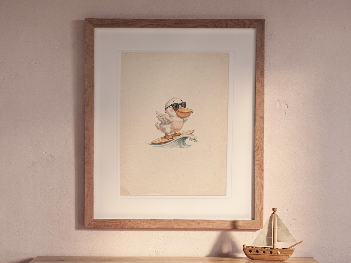 Pelican Surfing print in a Red Oak frame with a white mat, hanging above the bookshelf in a nursery.