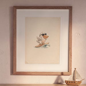 Pelican Surfing print in a Red Oak frame with a white mat, hanging above the bookshelf in a nursery.