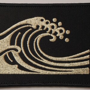 Wave Embroidered Patch Print framed in a beach-style living room setting