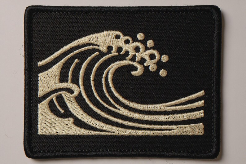 Wave Embroidered Patch Print framed in a beach-style living room setting