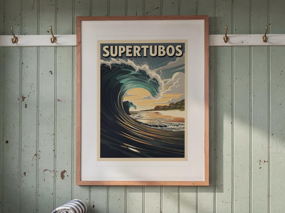 Supertubos Surf Travel Poster print in a Red Oak frame with a white mat, hanging above the bench in a beach cottage entryway.
