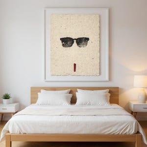 Sumi-e Wayfarer Sunglasses with Red Accent Print framed in a modern bedroom setting