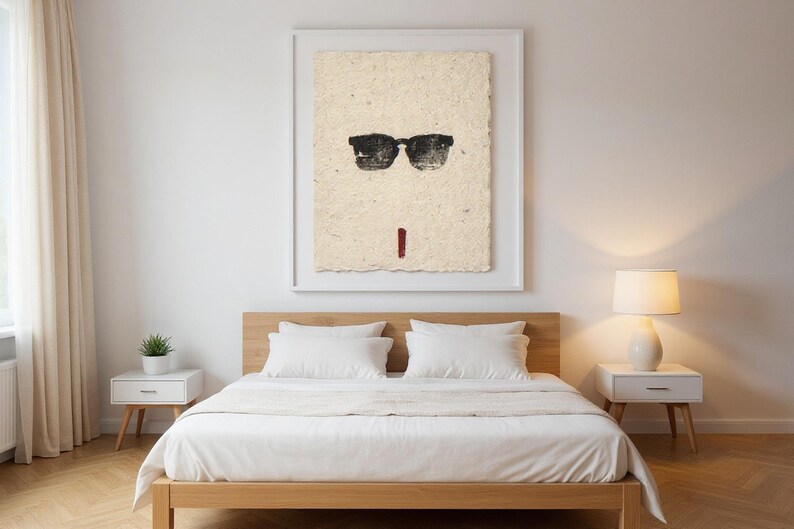 Sumi-e Wayfarer Sunglasses with Red Accent Print framed in a modern bedroom setting