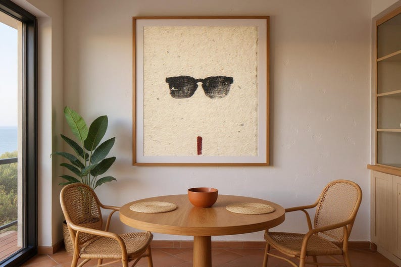 Sumi-e Wayfarer Sunglasses with Red Accent Print framed in a coastal dining room setting
