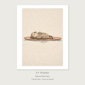 Sea Otter on Surfboard unframed 8 by 10 inch print on enhanced matte paper, shown with its white paper border.