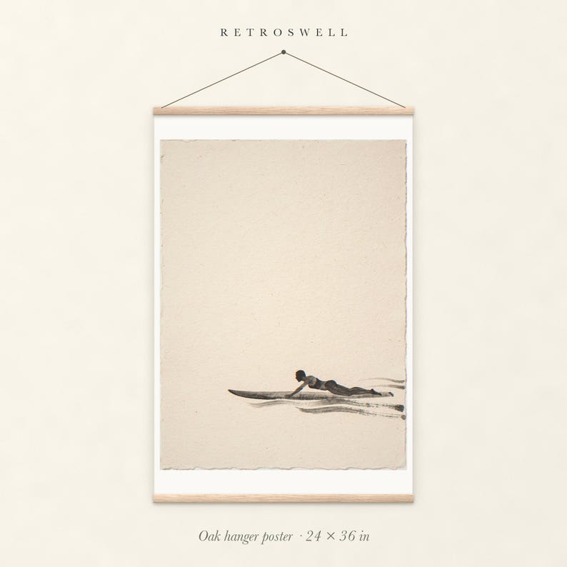 Paddling Surfer Ink Style oak hanger poster, 24 by 36 inches, with natural wood rails and a hanging cord.