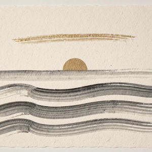 Sumi-e Seven Waves with Gold Accent Print framed in a beach-style living room setting