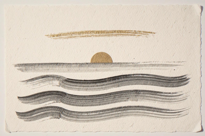 Sumi-e Seven Waves with Gold Accent Print framed in a beach-style living room setting