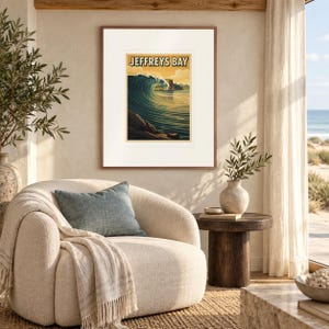 Jeffreys Bay Surf print in a Red Oak frame with a white mat in a light-filled coastal sitting room.
