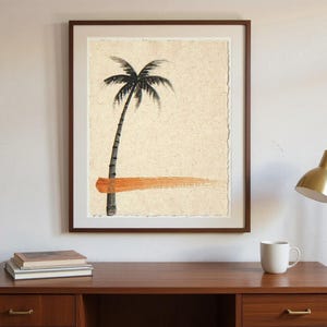 Sumi-e Lone Palm with Sunset Accent Print framed in a home office setting
