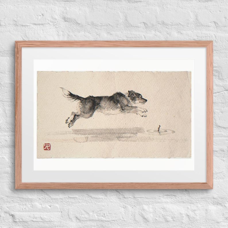 Dog Chasing a Stick Xieyi Ink print in a Red Oak 24 by 18 inch frame with a white mat on a white brick wall.