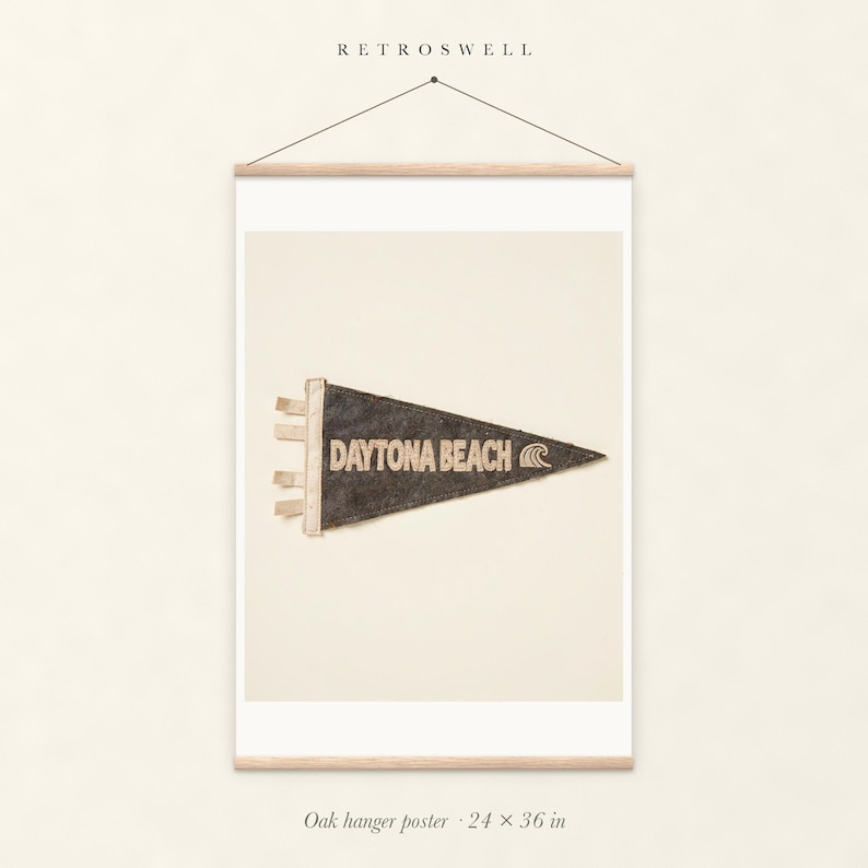 Daytona Beach, Florida Surf Pennant oak hanger poster, 24 by 36 inches, with natural wood rails and a hanging cord.
