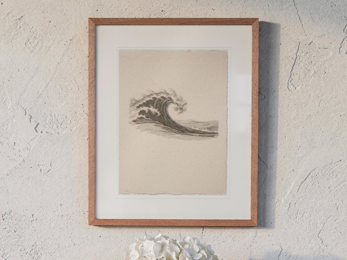 Wave Etching Style print in a Red Oak frame with a white mat, hanging above the table in a sunroom.