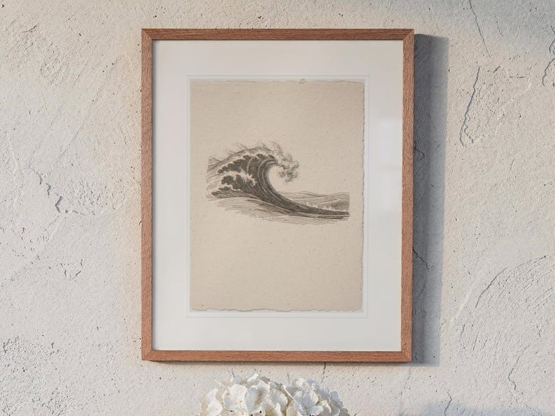Wave Etching Style print in a Red Oak frame with a white mat, hanging above the table in a sunroom.