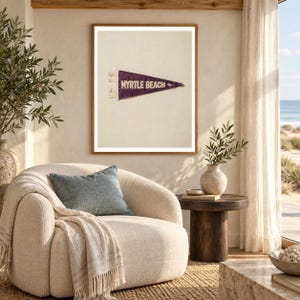Myrtle Beach art print shown framed in a light-filled coastal living room (frame not included). RetroSwell digital download.