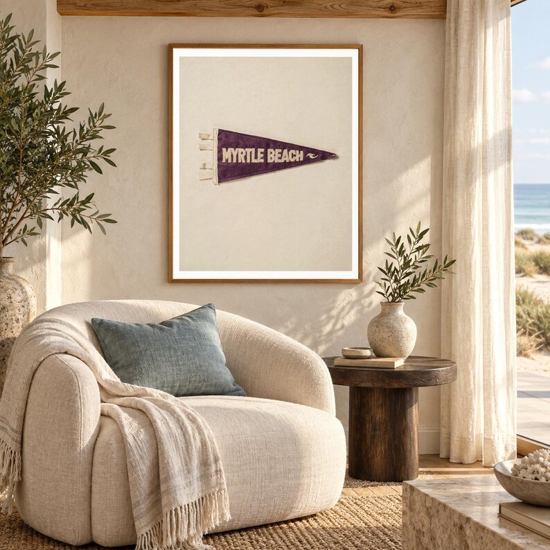 Myrtle Beach art print shown framed in a light-filled coastal living room (frame not included). RetroSwell digital download.