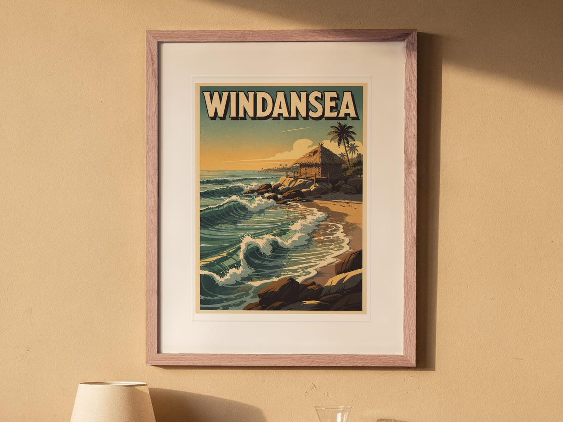 Windansea Surf Travel Poster print in a Red Oak frame with a white mat, hanging above the bedside table in a calm bedroom.