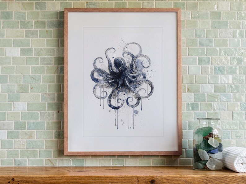 Octopus print in a Red Oak frame with a white mat, hanging above the vanity in a bright bathroom.