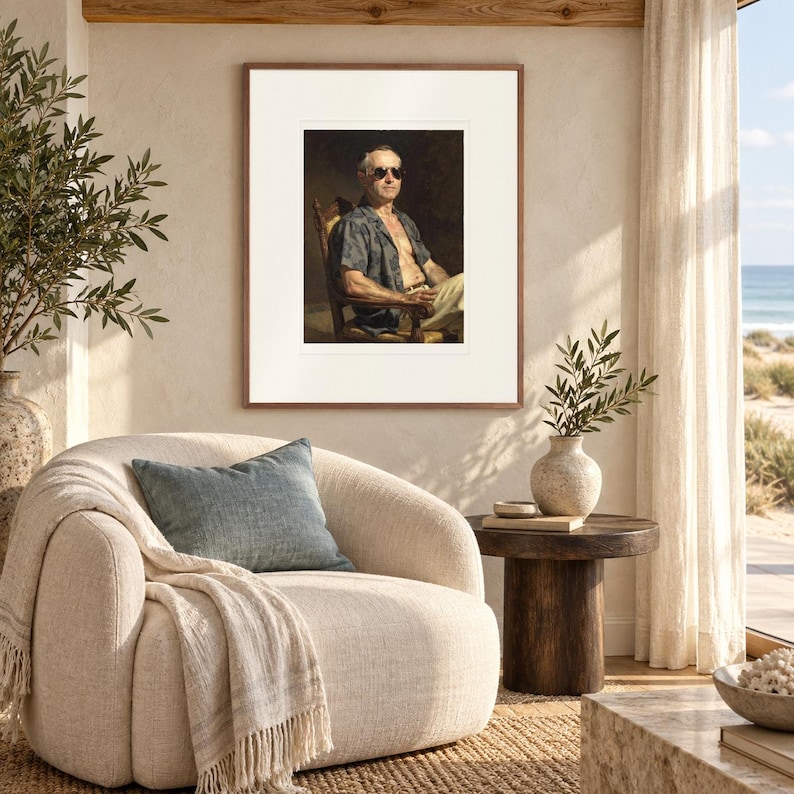 Calvin Coolidge Surfer print in a Red Oak frame with a white mat in a light-filled coastal sitting room.