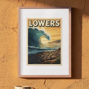 Lowers Trestles Surf Travel Poster print in a Red Oak frame with a white mat, hanging above the table in a boho living room.
