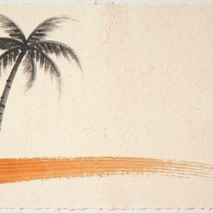 Sumi-e Lone Palm with Sunset Accent Print framed in a coastal dining room setting
