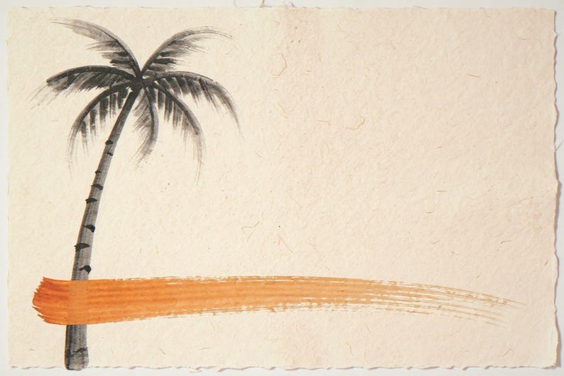 Sumi-e Lone Palm with Sunset Accent Print framed in a coastal dining room setting