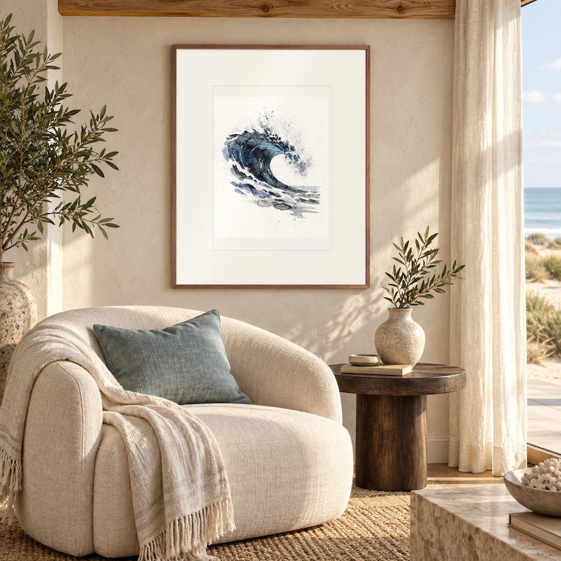 Indigo Barrel Wave Watercolor print in a Red Oak frame with a white mat in a light-filled coastal sitting room.
