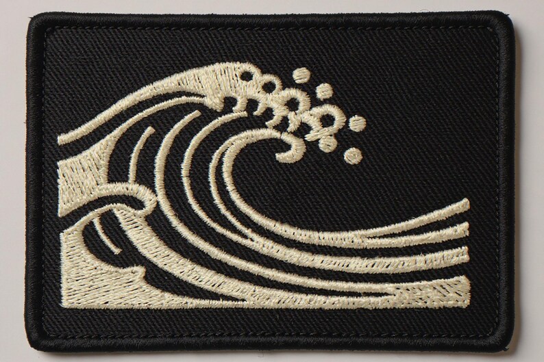 Wave Embroidered Patch Print framed in a coastal dining room setting