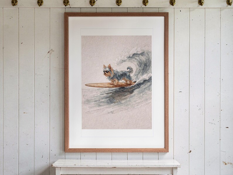 Yorkshire Terrier Surfing print in a Red Oak frame with a white mat, hanging above the bench in a beach cottage entryway.
