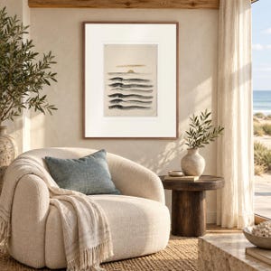 Layered Waves Ink Style print in a Red Oak frame with a white mat in a light-filled coastal sitting room.