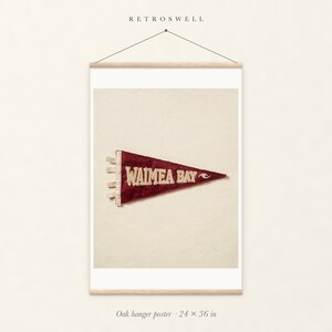 Waimea Bay Surf Pennant oak hanger poster, 24 by 36 inches, with natural wood rails and a hanging cord.