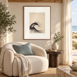 Breaking Wave Ink Style print in a Red Oak frame with a white mat in a light-filled coastal sitting room.