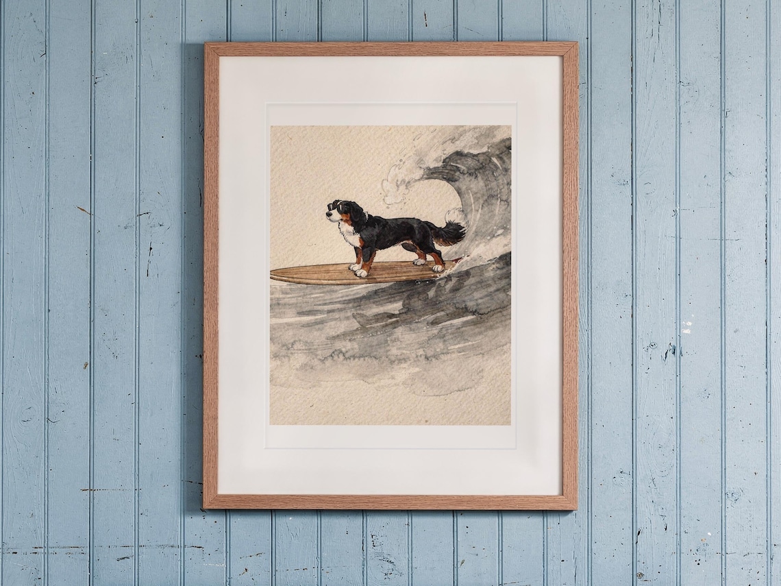Bernese Mountain Dog Surfing print in a Red Oak frame with a white mat, hanging above the bench in a beach cottage entryway.