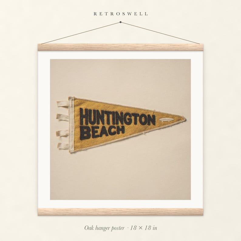 Huntington Beach Surf Pennant oak hanger poster, 18 by 18 inches, with natural wood rails and a hanging cord.